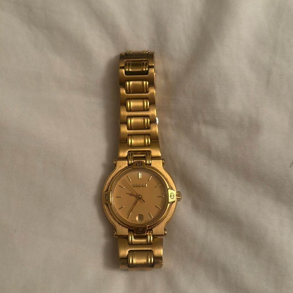 Authentic Gucci Ladies Gold Watch, date, second hand